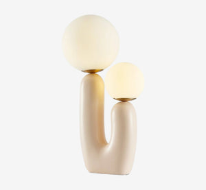 Modern Sculptural Cream Table Lamp – Dual Glass Globe Table Light with Organic U-Shaped Ceramic Base